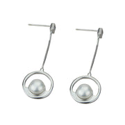 Sterling silver earrings with a pearl and circle, another view